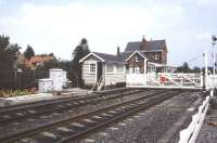 View towards Poppleton station from the west side of the level crossing in July 1989, looking towards York.<br><br>[Ian Dinmore /07/1989]