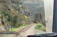 Drivers view from the twice daily metre gauge railcar as it threads the scenic Tua River gorge on its way down from Mirandela to Tua in the Douro Valley. Sadly, in August of that same year, a fatal accident occurred when a railbus derailed on this stretch and this caused the early closure of the line. Now a planned hydro-electric scheme will flood the trackbed. <br><br>[Mark Bartlett 18/03/2008]
