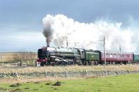 The outbound <I>'Cumbrian Mountain Express'</I> of 25 February 2012 photographed on Shap heading for Carlisle behind Britannia Pacific no 70013 <I>Oliver Cromwell</I>.<br><br>[Jim Peebles 25/02/2012]