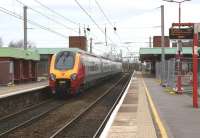 A Birmingham - Edinburgh Virgin Voyager calls at Wigan North Western on 21 March 2012. Like several other Virgin stations in the North-West, there are extensions to accommodate 11 car Pendolinos with extensive resurfacing work being carried out.<br><br>[John McIntyre 21/03/2012]
