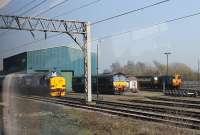 Direct Rail Services' Gresty Bridge Depot, as seen from a Shrewsbury to Crewe train on 24 March 2012. The picture shows newly painted EE Type 3 No. 37259, which had just been reinstated after a period in store, along with DRS Class 66 No. 66431, a <I>Northern Belle</I> liveried Class 47 and a Class 20. The train was held here at a signal for some time and the conductor announced that the delay was due to 'trains going in and out of Crewe station', which was probably all we passengers needed to know. <br><br>[Mark Bartlett 24/03/2012]