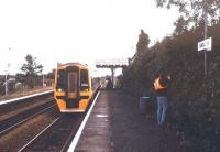 Hedge trimming in progress at Salhouse station, Norfolk, on a pleasant September afternoon in 1993 as a 158 pulls into the southbound platform with a Sheringham - Norwich service.<br><br>[Ian Dinmore /09/1993]