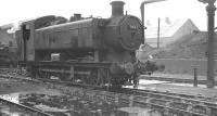 Hawksworth 0-6-0PT no 8467 stands in a wet Llanelli shed yard on 4 October 1961. The locomotive was withdrawn by BR the following February, while the shed itself, coded 87F, was officially closed in October 1965.<br><br>[K A Gray 04/10/1961]