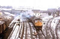 On a winter's day in early 1973 a northbound double-headed special accelerates out of the Rose Street curve in Inverness. The Harbour Branch is on the left and Platforms 5 and 6 of Inverness Station lie off to the right.<br><br>[David Spaven //1973]