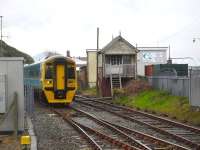 158829 passes the disused Pwllheli Frame Box as it runs into Pwllheli Station 7 minutes early on the 13.10 arrival from Birmingham International on 9 May 2012. <br><br>[David Pesterfield 09/05/2012]