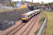 The 12.18 from Glasgow Queen Street takes the platform line at Alloa station junction on 9 May 2012.<br><br>[John Furnevel 09/05/2012]