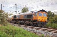 GB Railfreight 66733 leaves Millerhill Yard with the 6E45 Bridgeton Yard (ex-Fort William) Alcan empties to North Blyth on 4 June.<br><br>[Bill Roberton 04/06/2012]