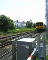 A Liverpool bound Merseyrail emu approaching Duke Street level crossing on 12 June shortly after leaving Southport station.<br><br>[Veronica Clibbery 12/06/2012]