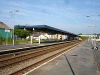 Looking east from the down island platform at Whitland in May 2012. The station buildings on the up platform are empty and boarded up and give a generally poor impression to travellers. <br><br>[David Pesterfield 23/05/2012]