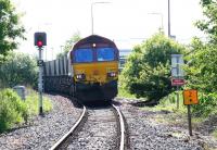 EWS 66078 approaching Seafield level crossing out of the sun with coal empties from Cockenzie power station heading back to Leith Docks on 9 June 2005.<br><br>[John Furnevel 09/06/2005]