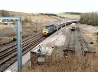The site of the former station at Grantshouse, Berwickshire, seen here in March 2004. Grantshouse station closed to passengers in 1964 and nowadays the cleared site provides ECML access and stabling facilities for maintenance and engineering staff. The passing train is the GNER Inverness - Kings Cross <I>Highland Chieftain</I><br><br>[John Furnevel 16/03/2004]
