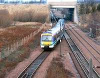 A train entering the reversing siding at the north end of Millerhill in December 2003 after terminating at Newcraighall station (platform just visible under bridge) with a service from Bathgate.<br><br>[John Furnevel 02/12/2003]