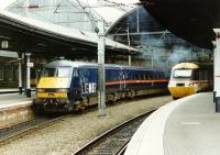 The west end of Newcastle Central in April 1997. On the left a GNER service has recently arrived from Kings Cross, while on the right an HST in BR InterCity livery is awaiting departure time with a Birmingham train.<br><br>[John Furnevel 05/04/1997]