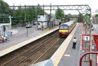 Platform 1 at Dalmuir looking east on 27 July 2005 with a train for Balloch entering the station.<br><br>[John Furnevel 27/07/2005]