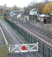 Looking north west towards Shildon station from Spout Lane road bridge in November 2004. The fence marks the boundary of the NRM site, with access to the yard and main exhibition hall via the gate on the left.<br><br>[John Furnevel 02/11/2004]