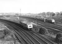 45036 on a Poole - Newcastle train passes 40085 on a PW train shortly after leaving York in 1980.<br><br>[John Furnevel 21/07/1980]