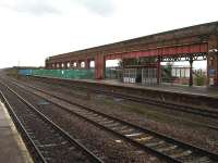 Canopy structures had been removed from much of platforms 2 and 3 at Wakefield Kirkgate by mid July 2012 as a precursor to the removal of most of the former overall roof supporting wall. [See image 39746]<br><br>[David Pesterfield 13/07/2012]