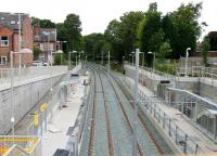A brand new Metrolink station under construction in 2012 on the East Didsbury line that reopened the following year. Although this is a new site for a station the line itself was once the old Midland main line out of Manchester Central, which closed to all traffic in 1969. As the trackbed was protected it has been available for use on the expanding Metrolink network. View towards Chorlton (-cum-Hardy) on 17 August 2012 from what became the station entrance.<br><br>[Mark Bartlett 17/08/2012]