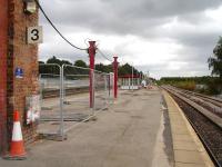 Looking east along a now lifeless platform 3 at Wakefield Kirkgate on 26 August 2012. This follows the removal of the bulk of the former overall roof support wall previously running almost the full length of the platform. The waiting shelter has been sited some distance from its final indicated position. [See image 34147]<br><br>[David Pesterfield 26/08/2012]