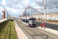 Heading for the southern terminus at Starr Gate <I>Flexity</I> No. 008 leaves the Pleasure Beach behind and runs along the refurbished tramway. This section of the Blackpool sea wall has a number of different scupltures, some of which can be seen in this view.<br><br>[Mark Bartlett 11/09/2012]