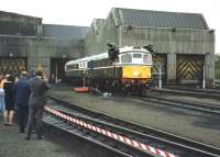 The first two examples of BRCW Type 2 locomotives to be built (in 1958) emerge from Eastfield MPD in a special ceremony in 1991, after being repainted in their original livery.<br><br>[David Spaven //1991]