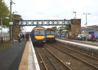 The crowds had been gathering on both platforms for over 30 minutes at Dyce in the afternoon of 19 October 2012. On the right the Inverurie to Edinburgh service is getting ready to depart, while on the left an Aberdeen to Inverness service is boarding. Off to the right were the former Buchan line platforms, now filled in and used as a car park. To the left of the station is Dyce Airport reached via a connecting bus service.<br>
<br><br>[John McIntyre 19/10/2012]