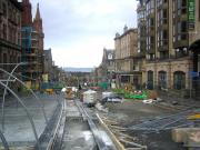 Looking north from the corner of St Andrew Square on 9 November 2012 showing work underway on the final leg of the planned Edinburgh Tram route. From here the trams will run straight ahead along North St Andrew Street to a point level with the neo-Gothic red sandstone building with the spire on the left (National Portrait Gallery) where they will turn sharp right into York Place and the terminus. In the centre background is the Firth of Forth with the hills of Fife beyond. [See image 41002]<br><br>[F Furnevel 09/12/2012]