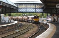 A DBS Class 66 takes the Dundee route at Perth station on 13 October 2012 with a rake of tank wagons.<br><br>[John McIntyre 13/10/2012]