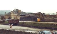 Derby built Type 2 Bo-Bo Diesel 25144 stabled alongside a lone 16T coal wagon in the former coal sidings running along the Broughton Road side of Skipton station in 1980.<br><br>[David Pesterfield 18/01/1980]