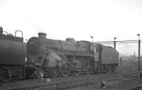 BR Standard class 4 4-6-0 no 75078 in the shed yard at 70A Nine Elms in October 1964. Withdrawn by BR in July 1966, the locomotive was rescued from Woodham Brothers, Barry, approximately 6 years later by the Keighley and Worth Valley Railway, where it is now preserved. <br><br>[K A Gray 23/10/1964]