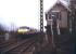 A diverted ECML electric train bound for Kings Cross being dragged through Littleworth station (closed to passengers in 1961) on the GN line between Peterborough and Spalding. View south from the A16 level crossing in January 1991. <br><br>[Ian Dinmore /01/1991]