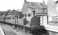 Adams class O2 0-4-4T no 30 <I>'Shorwell'</I> stands with a train at Cowes, Isle of Wight, on 16 August 1961. Cowes station was closed in 1966, a supermarket now occupies the site.  <br><br>[K A Gray 16/08/1961]