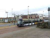 Passing the Blackpool Solarium, heading for the Starr Gate terminus in January 2013, is <I>Flexity</I> 013 on a service from Fleetwood Ferry. The <I>Art Deco style</I> Solarium was derelict for many years but is now an Eco Centre with cafe, park, exhibition and conference centre. <br><br>[Mark Bartlett 26/01/2013]