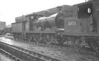 The shed yard at Nine Elms on a wet August afternoon in 1961 plays host to a pair of southern region veterans. On the left is 1904 Wainwright C class 0-6-0 no 31510, while alongside is Billinton E4 radial 0-6-2T  no 32473 of 1898 vintage. Both locomotives were withdrawn the following year, with the latter now famously preserved on the Bluebell Railway [see image 38400].<br><br>[K A Gray 21/08/1961]