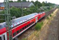 A DB <I>Regio</I> double-deck service from Hamburg runs through the eastern suburbs of Lubeck in the summer of 2010.<br><br>[John Steven 27/07/2010]