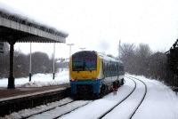 The 09.21 Cardiff - Holyhead service, formed by unit 175003, leaves a snow covered Wrexham General during a snowfall just after mid-day on 27 March 2013. <br><br>[David Pesterfield 27/03/2013]
