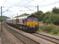 Tursdale Junction on the ECML between Darlington and Durham is where the line from Stockton joins. 66151 heads north with an empty coal train on 30 August 2010, as seen looking south from a train on the Stockton line.<br><br>[John McIntyre 30/08/2010]