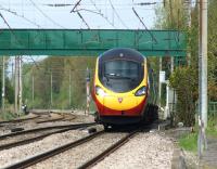 A southbound Pendolino negotiates the switchback that is the WCML at Euxton on 11 May 2013. The telephoto lens makes the track look more undulating than it really is. The ride is in fact surprisingly smooth, even at 110 mph plus.<br><br>[John McIntyre 11/05/2013]