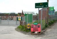 Entrance to the planned station and car park at Newtongrange on 22 May 2013. The A7 continues north along Murderdean Road (right) to cross the bridge over the trackbed, from which ramped access to the platform will also be available.<br><br>[John Furnevel 22/05/2013]