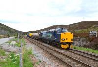 DRS liveried 37608 and 37259 take a nuclear flask wagon past Slochd Summit on the way to Georgemas Junction.<br><br>[John Gray 13/06/2013]