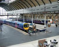The west end of Newcastle Central on 12 June, with a TransPennine 185 service for Manchester Airport at platform 9 and a Northern DMU for Carlisle boarding at platform 12. <br><br>[Veronica Clibbery 12/6/2013]