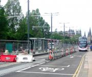 Looking west along Princes Street towards the Caledonian Hotel on 20 June 2013. Further work is currently in progress on The Mound tram stop.<br><br>[F Furnevel 20/06/2013]