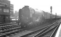 A1 Pacific no 60157 <I>Great Eastern</I> coming out of the sun and about to run through Doncaster station on the centre road on 31 May 1963. The train is the 7.51am Holloway sidings - Edinburgh Waverley <I>Anglo Scottish Car Carrier</I>, which would later become part of the BR <I>Motorail</I> service launched in 1966.<br><br>[K A Gray 31/05/1963]