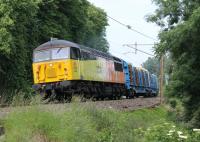 Colas Freight 56302 (formerly 56124) powers the Carlisle to Chirk log train up the gradient to the south of Lancaster station on 26th June 2013.<br><br>[Mark Bartlett 26/06/2013]