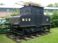 Cosmetically restored Siemens electric shunting locomotive E2 (Works no 455 of 1909), in National Coal Board livery, on a length of track at Beamish Museum in June 2013. No E2 was formerly part of the Harton Coal Company fleet and ended its working life at Westoe Colliery, South Shields, in the 1980s. [See image 18190]<br><br>[Veronica Clibbery 11/06/2013]