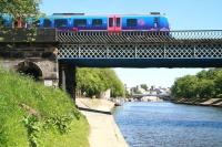 Looking south along the Ouse towards Lendal Bridge on 6 June, with the 13.48 TransPennine service from Scarborough to Liverpool Lime Street about to cross the river and enter York station.<br><br>[John Furnevel 06/06/2013]