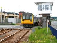 The 12.58 Saltburn - Darlington DMU takes the level crossing over West Dyke Road and enters Redcar Central station on 5 June 2013.<br><br>[John Furnevel 05/06/2013]