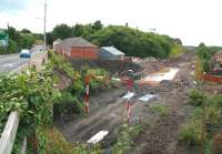 The site of Newtongrange station on 30 July looking south. The rain over the past week has created some additional water features here. The A7 runs past on the left.<br><br>[John Furnevel 30/07/2013]