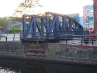 The truncated former railway swing bridge, sited next to <I>The Pumphouse</I> at the end of Gloucester Place, Swansea, in August 2013. The bridge once extended across the entrance channel to the large dock alongside the National Waterfront Museum's former Coast Lines transit shed.<br><br>[David Pesterfield 01/08/2013]