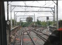 Metrolink driver's view of Irk Valley Junction, on a viaduct between Manchester Victoria and Woodlands Rd on the Bury line. The chord to the right closed in 1966 but was reinstated in 2012 for the Oldham and Rochdale Metrolink services. This junction was the scene of a major accident in 1953 when an EMU from Bury ran through a red signal and collided with a steam-hauled train on the crossover. The EMU fell from the viaduct and the driver and eight passengers were killed. <br><br>[Mark Bartlett 31/07/2013]